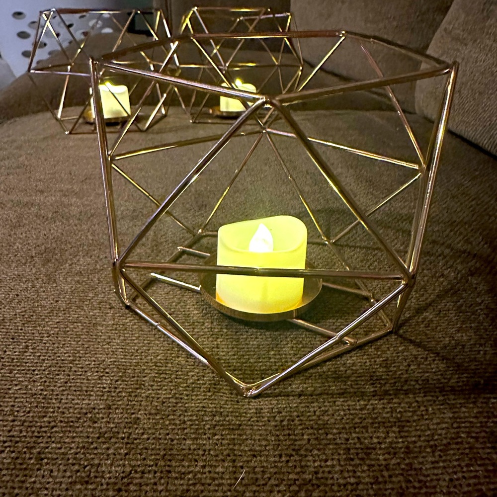 Set of three gold contemporary candle holders w/battery votives